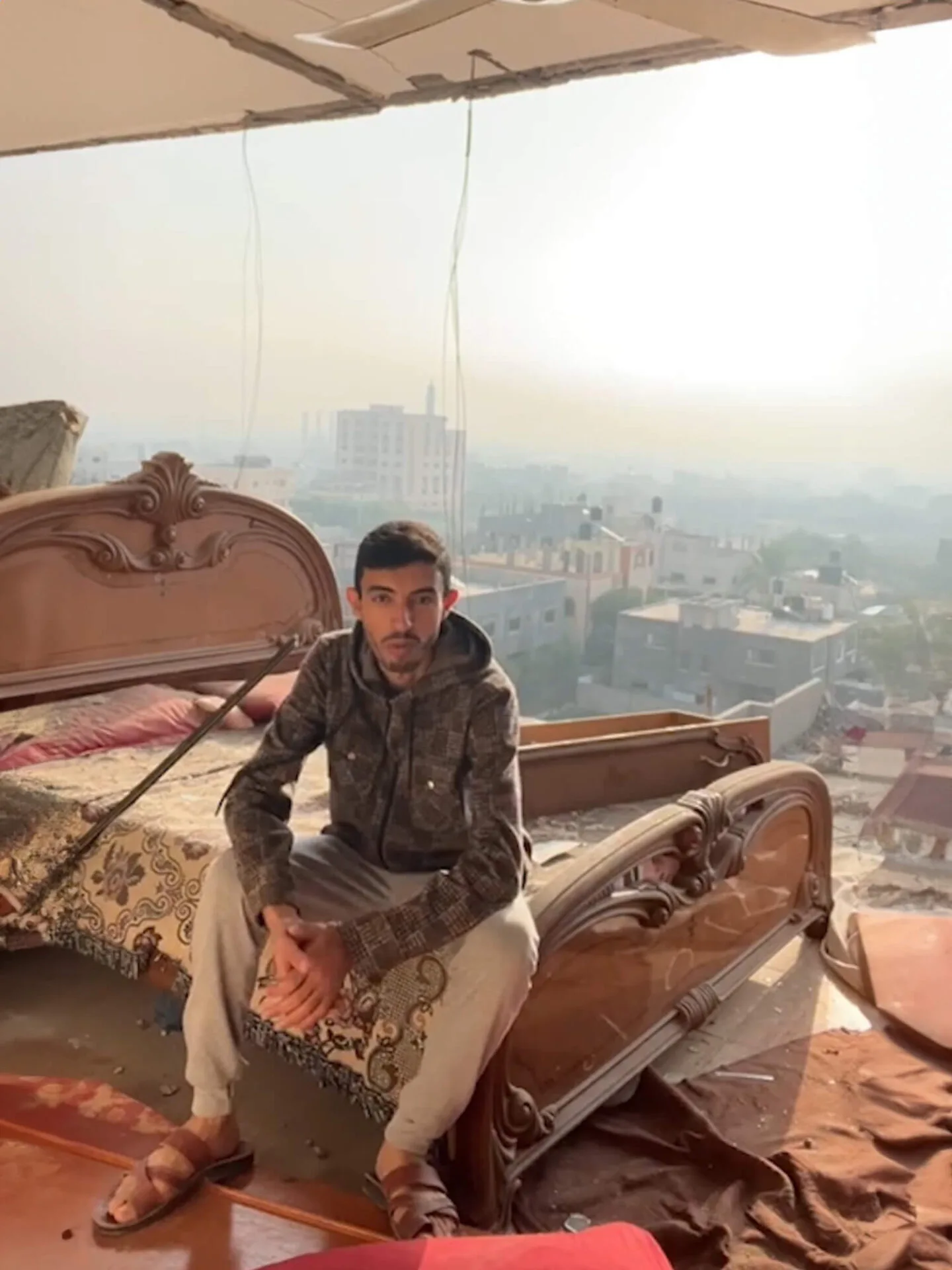 Still from Ahmad Alive: Ahmad in bombed bedroom